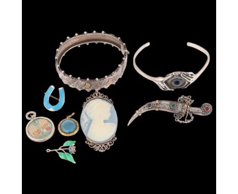 Various silver jewellery, including hinged bangle, eye cuff bangle, enamel lucky horseshoe brooch, etc . Condition Report: Lo