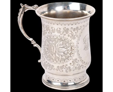 A Victorian silver christening mug, Daniel & Charles Houle, London 1865, flared cylindrical form, with engraved floral decora