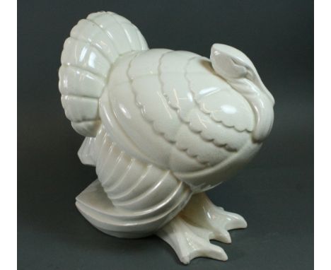 A French cream crackleglaze figure of a turkey, first half 20th century, 29cm high.