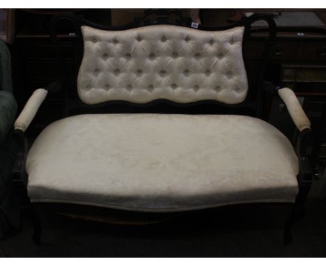 An Edwardian ebonised frame button down upholstered salon settee, on cabriole legs, 126cm wide and a similar mahogany salon c