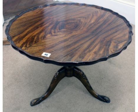 A reproduction mahogany shaped circular low centre table, on tripod base, 61cm diameter and a Regency style mahogany quartett