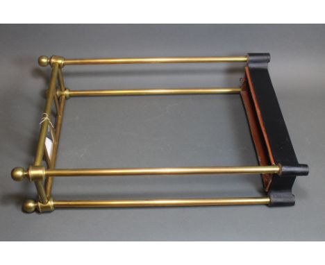 A Victorian style tubular brass four division stick stand, with iron base, 40cm.