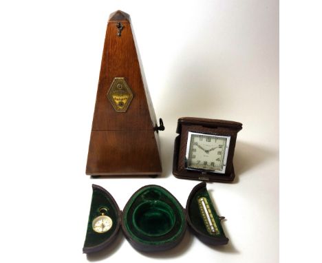 A French walnut cased metronome, Maelzel, an eight day Art Deco folding timepiece, signed 'John Bagshaw & Sons, Liverpool' an