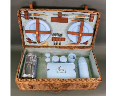A Coracle wicker picnic hamper, with fittings, presentation inscription dated 1958, 66cm wide x 36cm deep x 20cm high, a cont