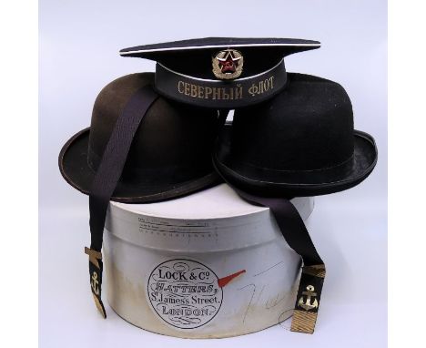 A collection of vintage hats including a Russian sailors hat and similar&nbsp;