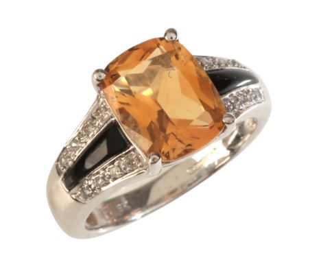 A CITRINE, ONYX AND DIAMOND RINGin 9ct white gold, set with a cushion cut citrine of c.2.65 carats, to stylised shoulders set