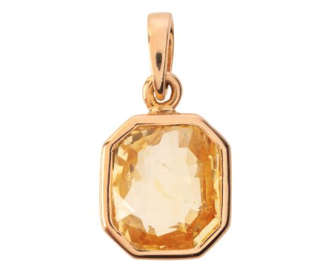 A YELLOW TOPAZ PENDANTin 18ct gold, set with an octagonal mixed cut yellow topaz of c.6.50 carats, held in a bezel setting, s