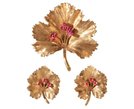 A VINTAGE RUBY LEAF BROOCH AND EARRING SUITEin 18ct gold, the brooch designed as a leaf, set with round cut rubies to the cen