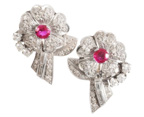 A PAIR OF RUBY AND DIAMOND FLOWER EARRINGSin platinum, each designed as a flower set to the centre with a round cut ruby and 