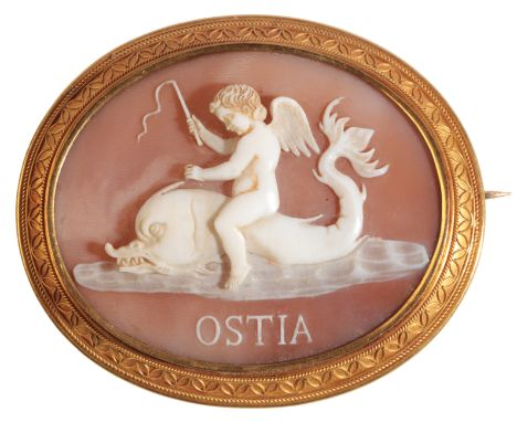 AN ANTIQUE CAMEO BROOCHin 18ct gold, set with a carved helmet shell cameo depicting Cupid riding a dolphin, over 'OSTIA' in r