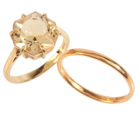 A VINTAGE CITRINE SOLITAIRE RINGin 18ct gold, set with an hexagonal mixed cut citrine of c.5.75 carats, full British hallmark