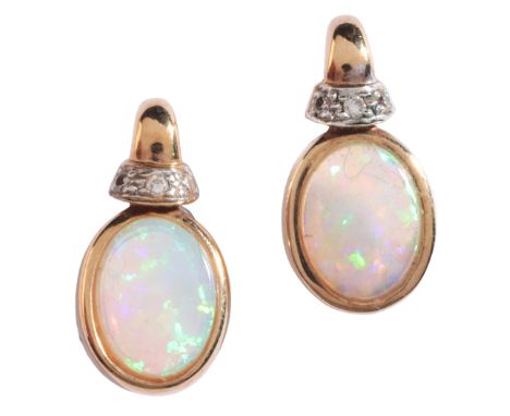 A PAIR OF OPAL AND DIAMOND EARRINGSin 9ct gold, each set with an opal cabochon held in a bezel setting, surmounted by a stud 