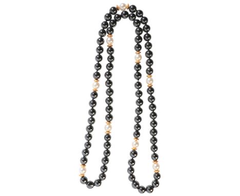 A HAEMATITE AND PEARL NECKLACE comprising a single row of haematite beads of c.8.3mm, accented by cultured pearls of c.8.0mm 