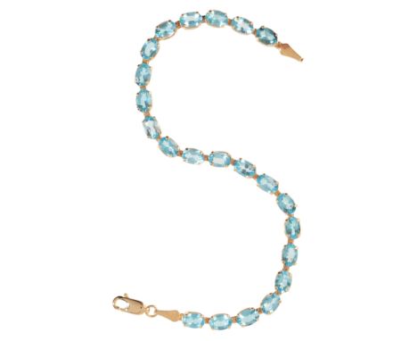 A TOPAZ BRACELETin 14ct gold, comprising a series of links set with oval cut blue topaz, secured with a lobster clasp, stampe