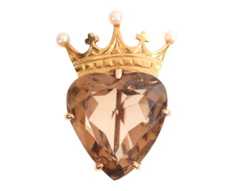 A CITRINE HEART AND CORONET BROOCHin 9ct gold, set with a heart shape citrine of c.24.16 carats, held in a claw setting below