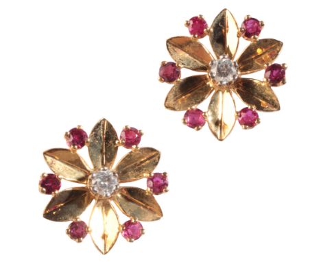 A PAIR OF RUBY AND DIAMOND FLOWER STUD EARRINGSin 18ct gold, each set to the centre with a round brilliant cut diamond, to st