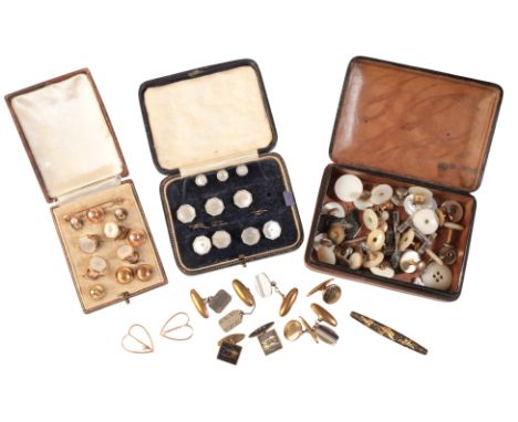 A COLLECTION OF CUFFLINKS AND DRESS STUDSincluding a mother of pearl button stud and stock pin suite in in 9ct gold, displaye