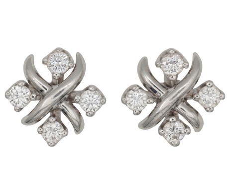 JEAN SCHLUMBERGER FOR TIFFANY & CO: A PAIR OF LYNN DIAMOND EARRINGSin platinum, each designed as a stylised cross set with fo