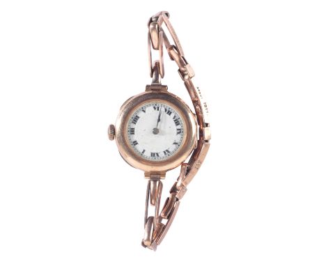 VERTEX: A LADY'S 9CT GOLD WRISTWATCHwith manual wind movement, the white enamel dial with black Roman numerals and dark blue 