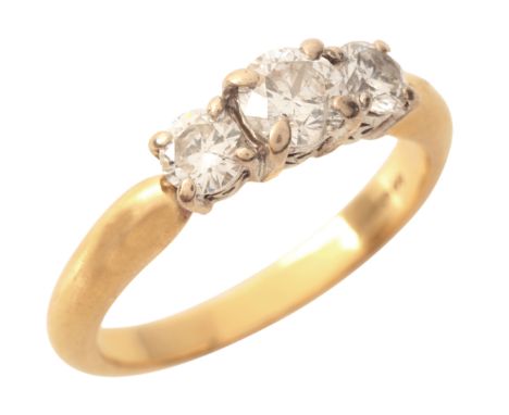 A DIAMOND THREE STONE RINGin 18ct gold and platinum, set with three graduated round brilliant cut diamonds, totalling c.1.00 