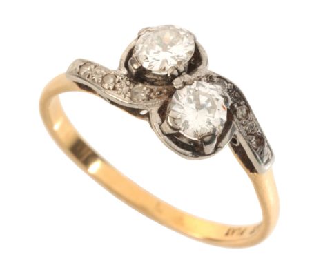 A DIAMOND TOI-ET-MOI RINGin 18ct gold and platinum, set with two old European cut diamonds, to sweeping shoulders set with si