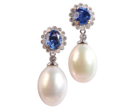 A PAIR OF PEARL AND SAPPHIRE DROP EARRINGSin 18ct white gold, each set with an oval cut sapphire and diamond cluster stud, su