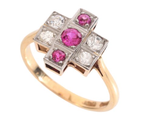 A RUBY AND DIAMOND DRESS RINGin 18ct gold and platinum, set with three graduating round cut rubies to the centre, flanked by 