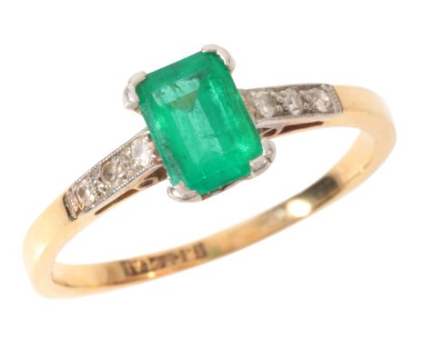 AN EMERALD AND DIAMOND RINGin 18ct gold and platinum, set with a step cut emerald of c.0.70 carats, to diamonds-set shoulders