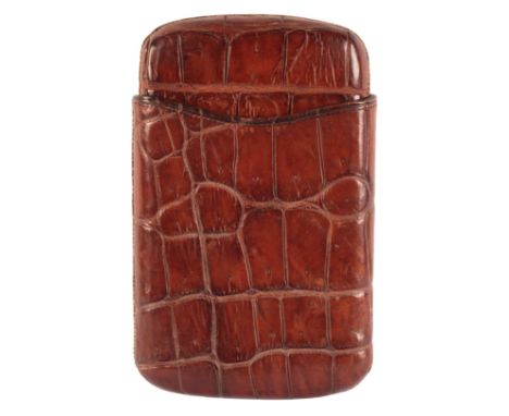 AN EDWARDIAN MID-BROWN CROCODILE SKIN CIGAR CASEcirca 1940's, to hold approximately six cigars, 14cm x 10cm