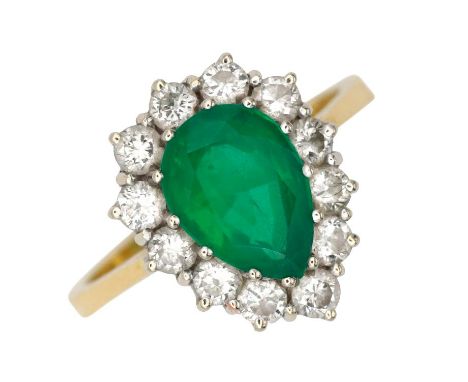 AN EMERALD AND DIAMOND CLUSTER RINGin 18ct gold, set with a pear cut emerald of c.2.20 carats, surrounded by a cluster of rou