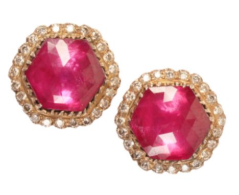 A PAIR OF RUBY AND DIAMOND CLUSTER EARRINGSin 18ct gold, each set with a faceted glass-filled ruby surrounded by a hexagonal 