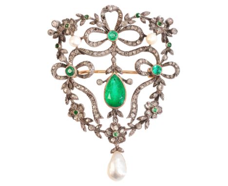 AN ANTIQUE EMERALD, DIAMOND AND PEARL BROOCHin silver on 9ct gold, in a stylised floral and bow design, set to the centre wit