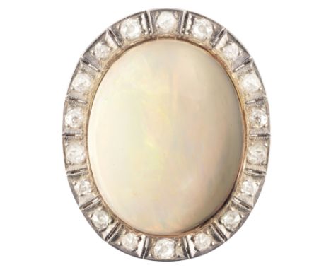 AN OPAL AND DIAMOND CLUSTERin 18ct gold and platinum, set with an opal cabochon of c.53.30 carats, held in a bezel setting, s