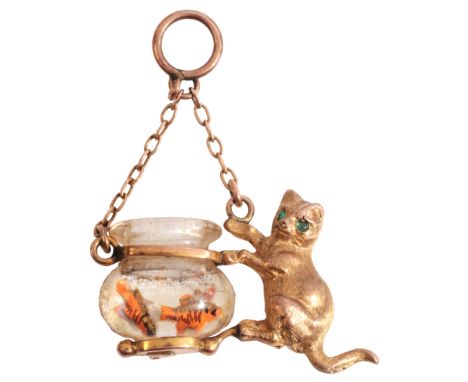 AN ANTIQUE CAT AND FISH BOWL PENDANTin 9ct gold, the cat set with emerald cabochon eyes, suspended from a chain link bail, st