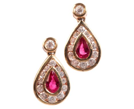 A PAIR OF RUBY AND DIAMOND EARRINGSin 18ct gold, each set with a round brilliant cut diamond stud, articulated to a pear shap