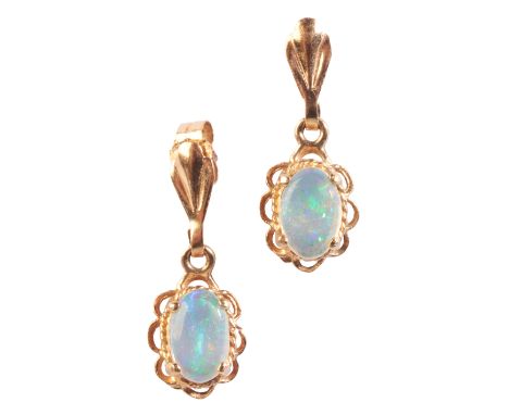 A PAIR OF OPAL DROP EARRINGSin 9ct gold, each set with an opal cabochon held in a claw setting, surrounded by a stylised rope