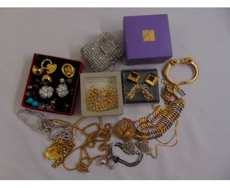 A quantity of costume jewellery to include a Christian Dior bracelet, Monet earrings and other earrings, bracelets and neckla