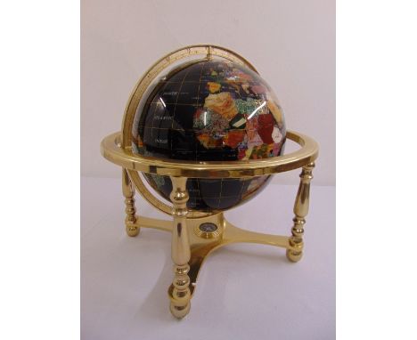 A lapis gem stone globe in gilded metal stand to include original packaging