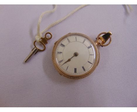 9ct gold pocket watch with enamel dial and Roman numerals, to include key