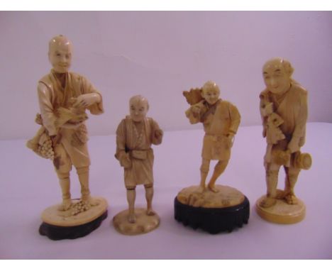 Four 19th century ivory oriental figurines on raised bases all signed