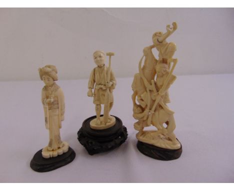 Three late 19th century Japanese carved ivory figurines on carved wooden bases