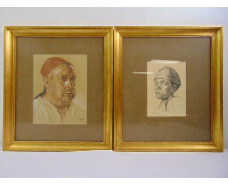 A framed and glazed polychromatic sketch of a man wearing a red cap and framed and glazed pencil drawing of a boy
