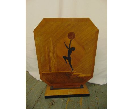 An Art Deco shaped rectangular wooden fire screen inset with a female figure on raised rectangular plinth