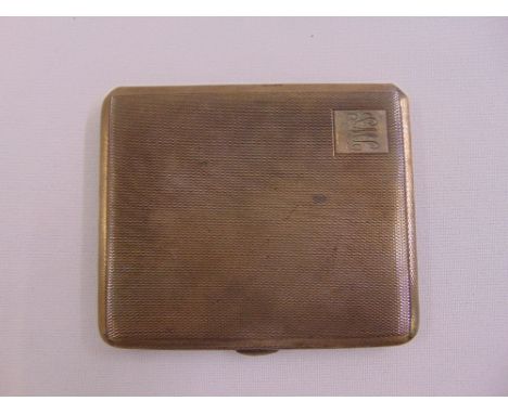 A silver rectangular engine turned cigarette case