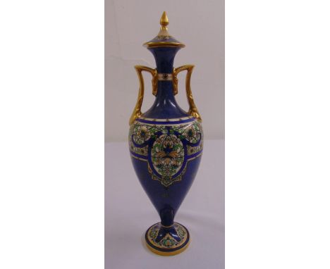 A Royal Worcester covered vase of baluster form with angled side handles on raised circular foot  A/F