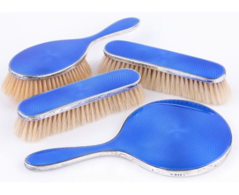 A 4-piece silver and blue enamel backed brush and mirror set, (4).