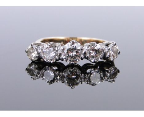 18ct gold 5 stone diamond ring,
over 1ct total, setting width 21mm, size K.