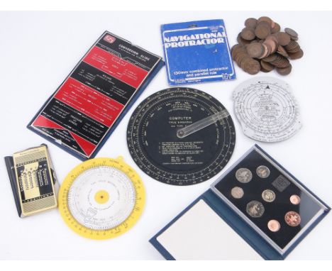5 various Air Navigation computers,
a baby Add Master, 100 old pennies and a 1984 proof set.