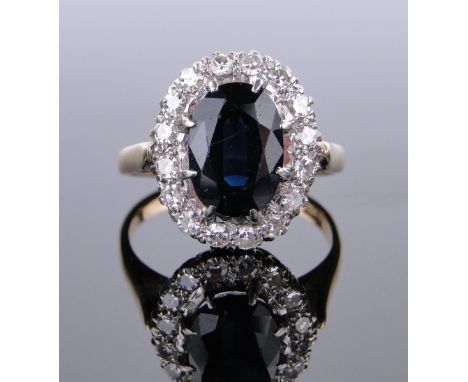 18ct gold sapphire and diamond cluster ring,
setting height 15mm, size K.