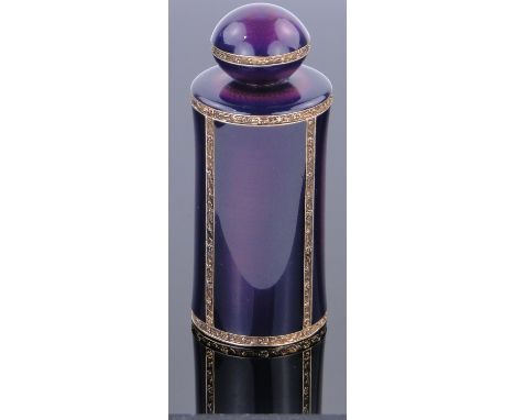 A fine quality purple enamel and unmarked gilt metal perfume bottle,
with domed screw-on top and floral cast bands, height 8.